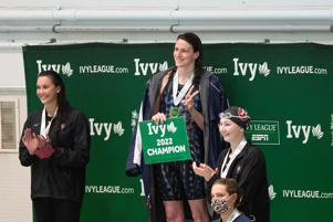 CAMBRIDGE, MA - FEBRUARY 18: University of Pennsylvania swimmer Lee Thomas smiles on the podium after winning the 200m freestyle at the 2022 Ivy League Women's Swimming and Diving Championships on February 18 at Blodgett Basin in Massachusetts.