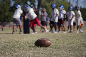 A high school football team practices Wednesday, Sept. 28, 2022, in Oklahoma City. Oklahoma has passed a new law that prohibits elementary, middle, high school and college athletes from competing on sports teams of their gender identity if they are different from their birth gender. While more than a dozen other states have similar laws, Oklahoma is the only known state that requires "biological proof of sex" to participate. (AP Photo/Sue Agrotsky)