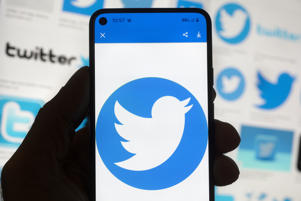 FILE - The Twitter logo is seen on a mobile phone in Boston, October 14, 2022. Social media platforms including Facebook, TikTok and Twitter say they are taking steps to stop the spread of false information about voting and elections ahead of midterm elections to avoid next month . However, browsing some popular platforms shows that the number of unsubstantiated claims of electoral fraud is on the rise. (AP Photo/Michael Dwyer, file)