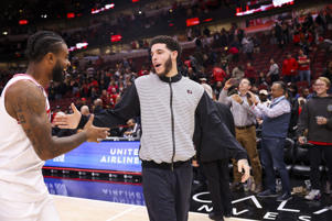 Bulls defensive end Kobe White (L) talks to Lonzo Ball after defeating the Packers October 26, 2022 at the United Center.