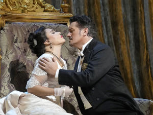 In this image provided by the Met Opera, Sonia Yonchava in Fedora (left) and Piotr Betsala in Loris Ipanov in Giordano's Fedora. (Ken Howard/Met Opera via AP)