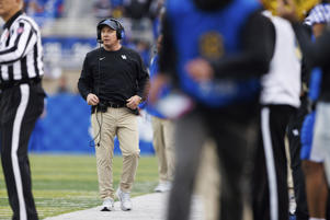 FILE - Kentucky coach Mark Stoops watches the video screen during an NCAA college football game against Louisville in Lexington, Kentucky, Nov. 26, 2022. Iowa (7-5) and Kentucky (7-5) will battle it out. . Saturday, December 31, 2022 at Music City Bowl. (AP Photo/Michael Clubb, File)