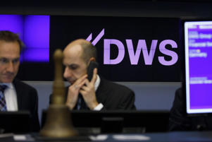 Deutsche Bank's DWS Group logo for asset management arm Deutsche Börse AG on the Frankfurt Stock Exchange on Friday, March 23, 2008. 2018. DWS held its own on the first day of trading after parent company Deutsche Bank raised about 1.4 billion euros (.7 billion) in an initial public offering.