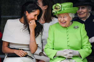 On June 14, 2018, Meghan Markle took a rare solo photo with Queen Elizabeth II. The Queen died on 8 September 2022 at Balmoral Castle. Jeff J. Mitchell/Getty Images