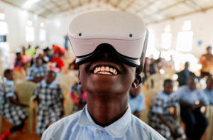 Francis Mwangi, 13, uses an Oculus virtual reality headset on June 2, 2022 in Payne, Kenya. Reuters/Thomas Mukoa