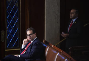Rep. George Santos (R-N.Y.) watches floor proceedings in the House on Friday.