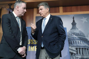 Fame. Brian Fitzpatrick, R-Pennsylvania, left, listens to Sen. Joe Manchin, D-W.Va., during a news conference on legislation to ban energy supplies from Russia, Thursday, March 3, 2022, on Capitol Hill in Washington. (AP Photo/Jacqueline Martin)