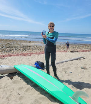 Sally Sanger, now 67, has a surfing award she won last year in San Clemente, California.