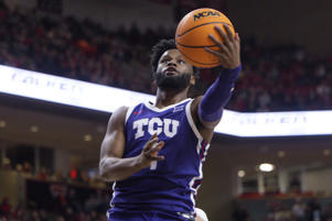 Mike Miles Jr. of TCU (1) shoots during the first half of an NCAA college basketball game against Texas Tech on Saturday, Feb. 25, 2023 in Lubbock, Texas. (AP Photo/Chase Seabolt)